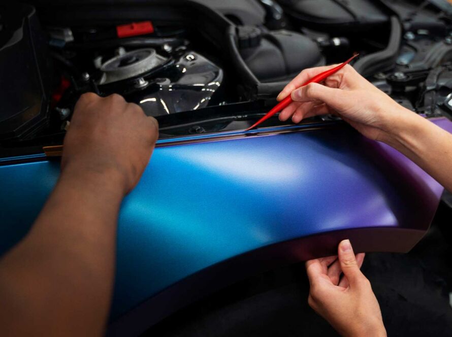 Close up of multishade car wrap installation by professional installer in Buena Park